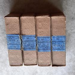4 bo&icirc;tes vide de munitions de 9 mm