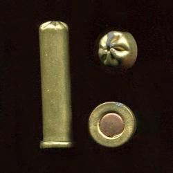 6 mm &agrave; blanc - &eacute;tui laiton de 28 mm ferm&eacute; en rosette 6 plis - amorce cuivre - RARE