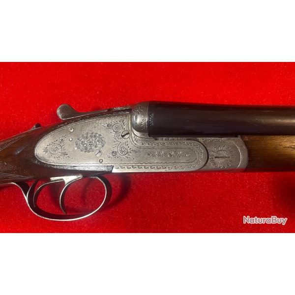 JUXTAPOS� A PLATINE SARRIUGARTE, BON �TAT, GRAVURE FAIT � LA MAIN, CALIBRE : 16/70, CANONS : 70 CM.