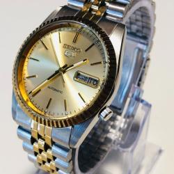 Montre Seiko 5 Automatique Bicolore Cadran Dor&eacute; Soleil Lunette Cannel&eacute;e Calibre 7009 tr&egrave;s bon &eacute;tat