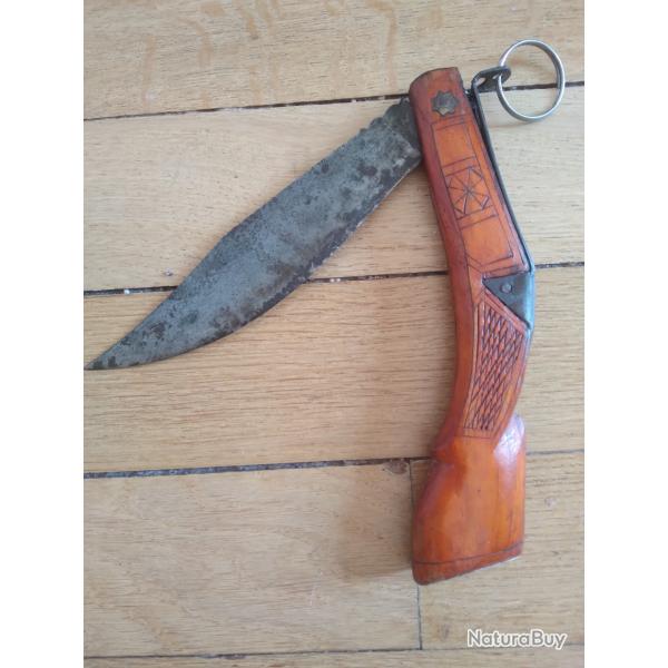 fort couteau pliant en forme de fusil