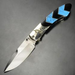 Couteau Rough Rider Turquoise Peak Lame Acier 440 Manche Imitation Turquoise Noir Linerlock RR1578