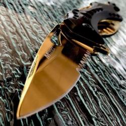 Couteau Mtech Ballistic Gold A/O Lame Acier Inox Serrated Manche ABs Ouvre Bouteilles MTA705BG