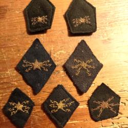 Militaria, 4 insignes de bras et 3 de col, t&eacute;l&eacute;graphistes des troupes coloniales, mod&egrave;le 35.